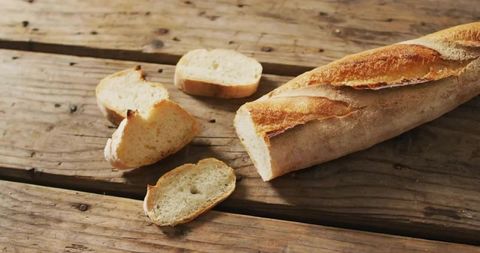 Artisanal french baguette on rustic wooden table