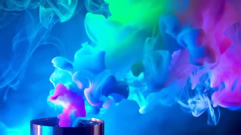 Metal Canister Releasing Neon Vapor Forming Cyan Magenta Green Swirls Over Dark Surface