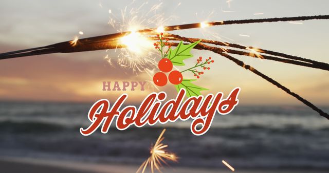 Image of happy holidays text over sparklers at beach. Christmas, celebration and digital interface concept digitally generated image.