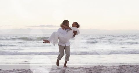 Joyful Newlyweds Embrace Romantic Beach Wedding