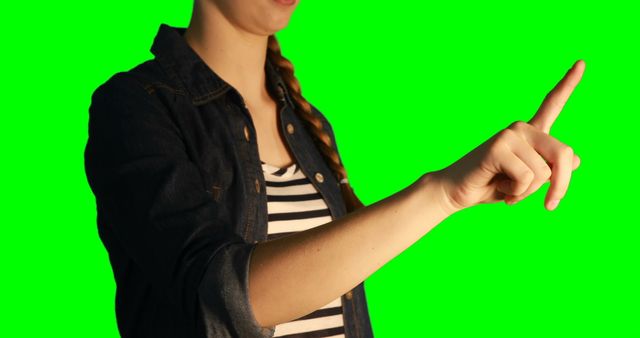 Woman Pointing Up on Green Screen Background with Striped Shirt - Download Free Stock Images Pikwizard.com