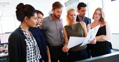 Diverse Team Collaborating on Important Business Decisions