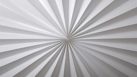 Radiating circular pleated ceiling panel with central focal point and geometric symmetry