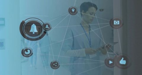 Nurse in blue scrubs using tablet with digital connectivity icons overlay