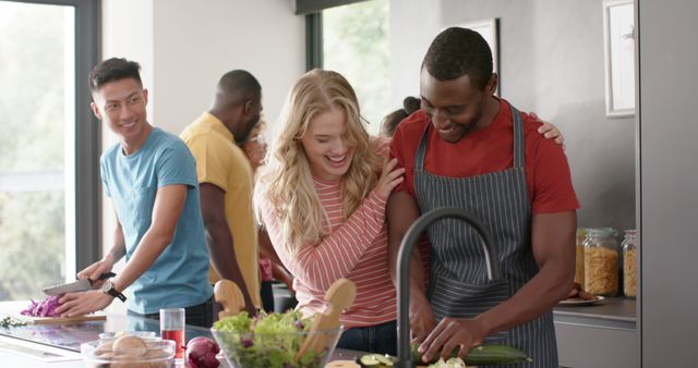 Diverse Group of Friends Enjoying Cooking Together in Kitchen - Download Free Stock Images Pikwizard.com