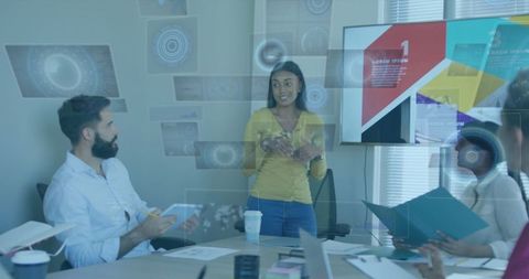 Innovative businesswoman presenting technology in modern office