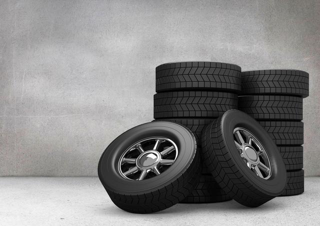 Stack of tyres kept on grey background
