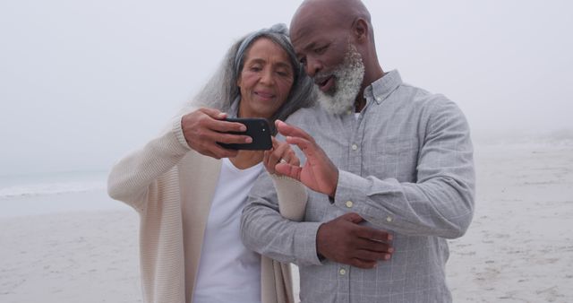 Senior Couple Enjoying Time at Beach Taking Selfie Together - Download Free Stock Images Pikwizard.com