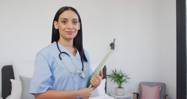 Confident Female Nurse Holding Patient File in Modern Hospital Room - Download Free Stock Images Pikwizard.com