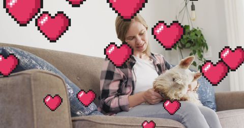 Smiling Woman Enjoying Time with Dog Surrounded by Pixel Hearts