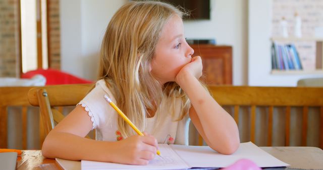 Thoughtful Young Girl Daydreaming while Writing - Download Free Stock Images Pikwizard.com