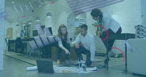 Team collaborating on financial project with data visualization