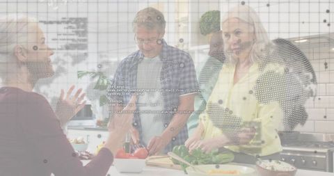 Seniors preparing fresh meal together in modern kitchen with digital world map overlay