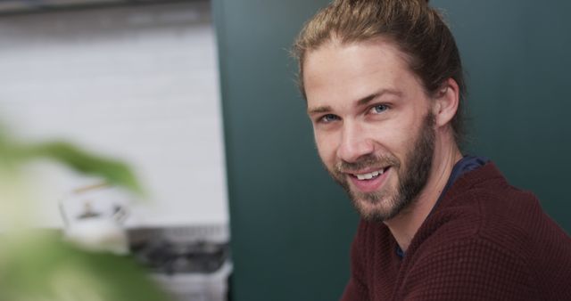 Smiling Man with Long Hair and Beard in Casual Setting - Download Free Stock Images Pikwizard.com