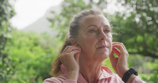 Middle-Aged Woman Preparing for a Run in Nature - Download Free Stock Images Pikwizard.com