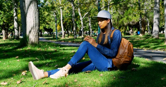 Student Relaxing in Park with Smartphone - Download Free Stock Images Pikwizard.com