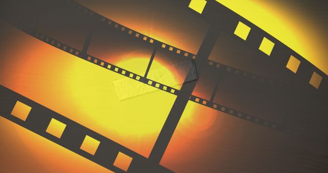 Curled Film Strip with Glowing Background Creating Warm Dynamic Effect - Download Free Stock Images Pikwizard.com