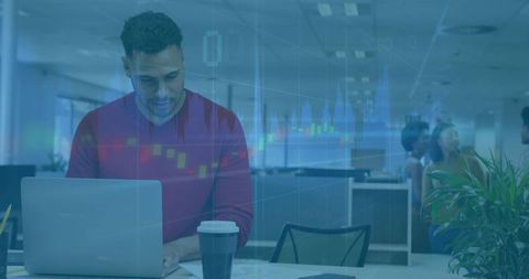 Financial analyst typing on laptop in open-plan office with stock chart overlay