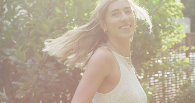 Smiling Woman Enjoying Sunny Day in Garden - Download Free Stock Images Pikwizard.com