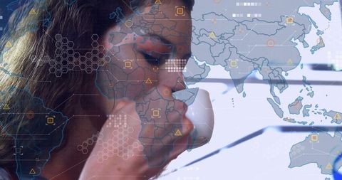 Sipping coffee while studying global data visualization hud overlay on modern workspace