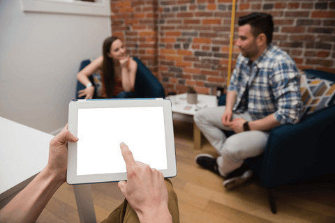 Hands holding transparent tablet design and room interaction concept
