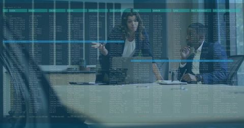 Executives Pointing at Laptop with Data Overlay Emphasizing Cybersecurity Collaboration