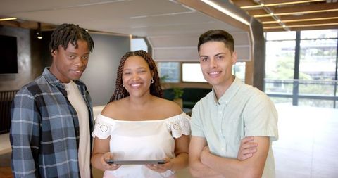 Smiling Young Professionals Collaborating in Modern Office