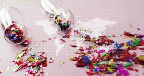 Colorful metallic confetti spilling from glass vials over dotted world map hud overlay