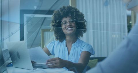 Confident Businesswoman in Tech-Savvy Office Environment