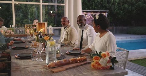 Elegant Outdoor Wedding Celebration with Diverse Guests Socializing