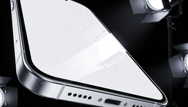 Showcasing cracked smartphone corner with brushed aluminum frame and studio reflections