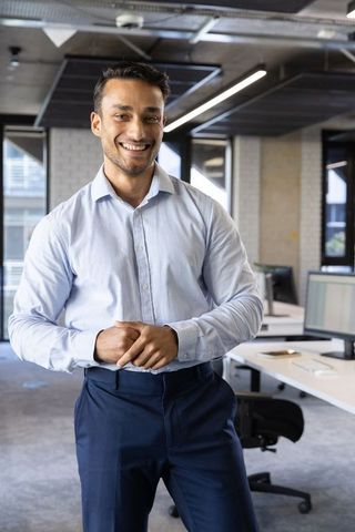 Confident Business Professional in Modern Open Plan Office Setting