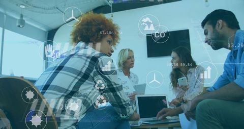 Professionals Analyzing Sustainability Data with Tech Interfaces