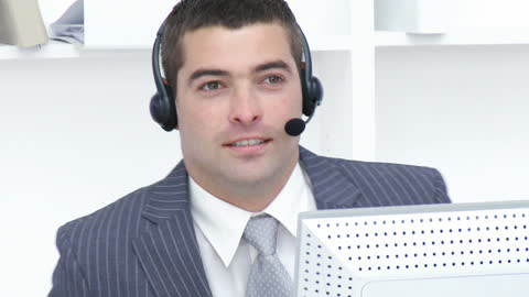 Professional Office Employee Wearing Headset in Call Center Environment