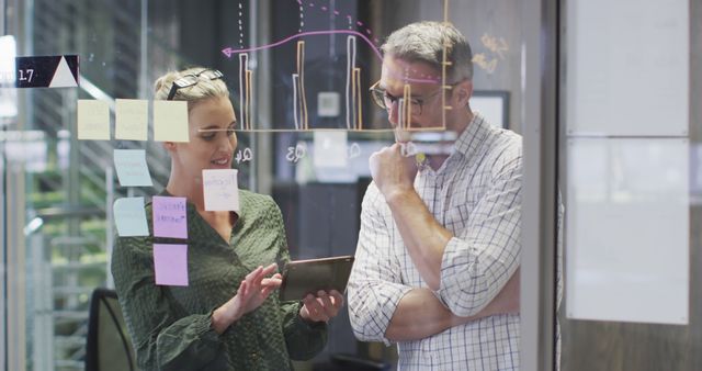 Image of happy caucasian female and male designers brainstorming in office - Download Free Stock Photos Pikwizard.com