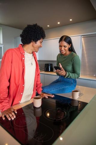 Couple enjoying quality time together in modern kitchen