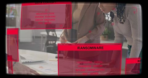 Business leaders investigating ransomware alert overlaid hud on office laptop charts