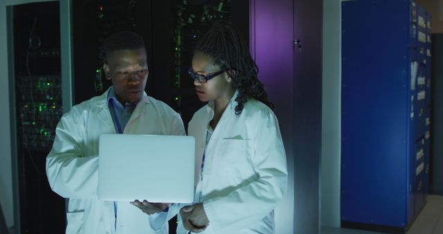 Scientists Collaborating in High-Tech Research Facility with Laptop - Download Free Stock Images Pikwizard.com