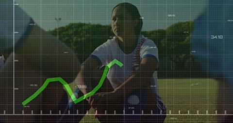 Focused Female Soccer Player With Superimposed Financial Data