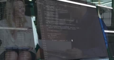 Professionals Collaboration Over Code Discussing Teamwork & Innovation