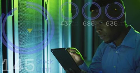 IT Technician Monitoring Tablet in Data Center with HUD Metrics and Futuristic Lighting