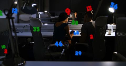 Business Professionals Analyzing Data in Modern Office at Night - Download Free Stock Images Pikwizard.com