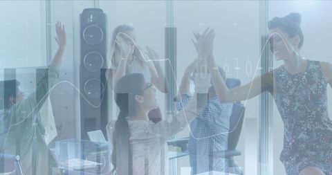 Business Team High-Fiving Amidst Financial Overlay