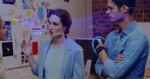 Finance Team Analyzing Data Trends in Office Environment