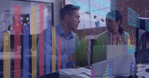 Collaborating on data dashboards with laptop and chart overlays in modern open-plan office