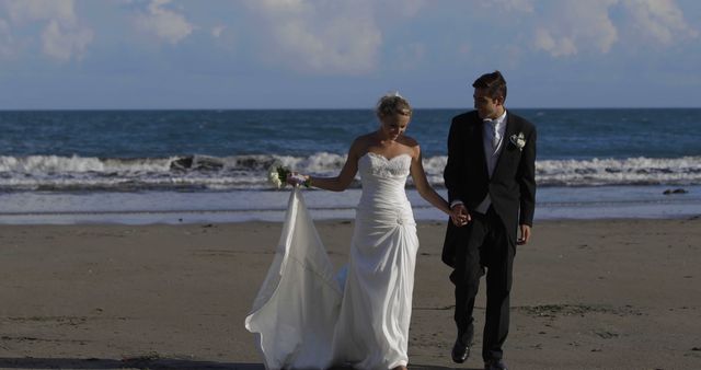 Newlywed Couple Holding Hands on Beach Wedding at Sunset - Download Free Stock Images Pikwizard.com