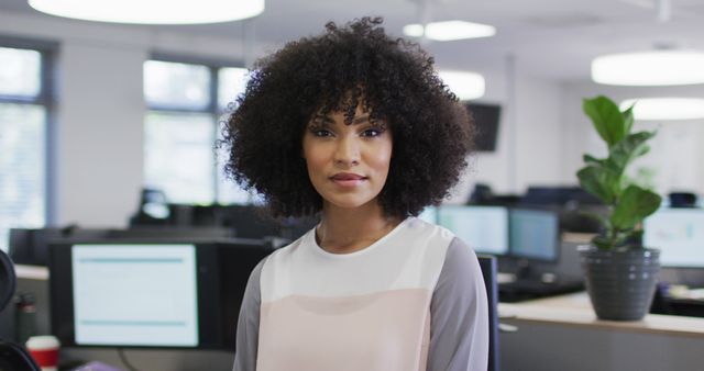 Confident Businesswoman in Modern Office Setting Smiling - Download Free Stock Images Pikwizard.com