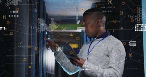 African American Engineer Using Tablet in Modern Data Server Room - Download Free Stock Images Pikwizard.com