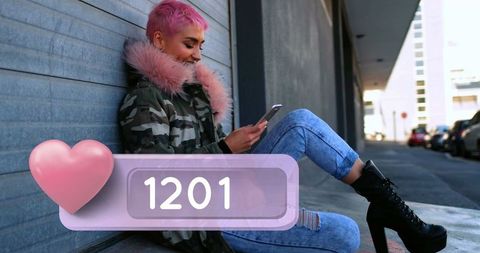 Trendy Woman with Pink Hair Engaging on Smartphone in Urban Environment