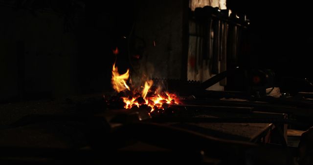 Iron rod being heated in fire at workshop 4k
